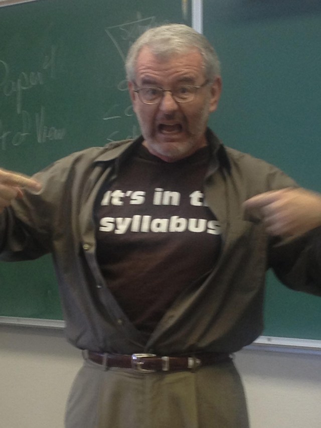 David Lydic using his t shirt, that reads it's in the syllabus, to answer a student question that is in the syllabus.