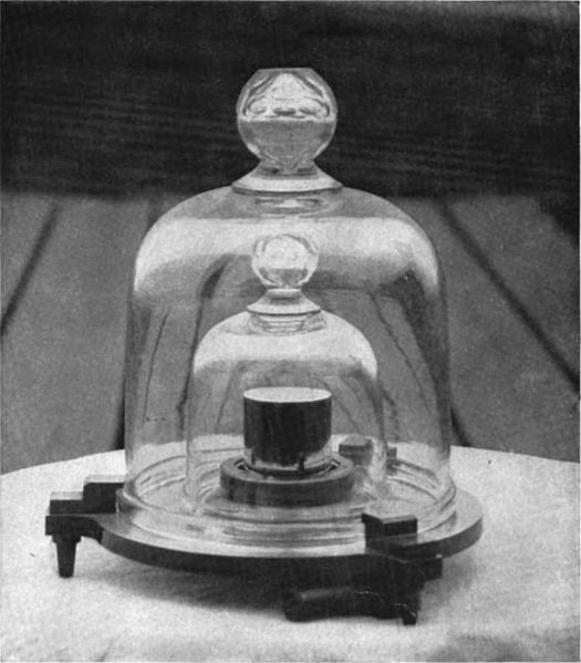 The original Kilogram stored in several bell jars.