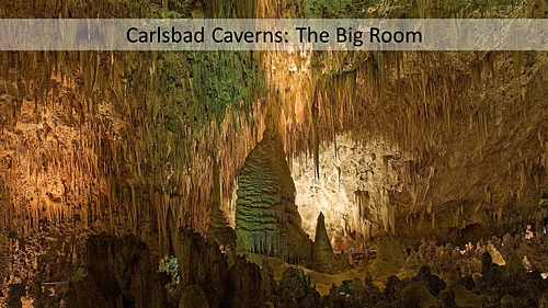 A slide filed with an image of the Carlsbad Cavern Big room. With a text box filled with translucent white and black text.